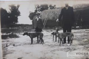 Ralph Smith as a boy, with Mr. Kingswell of Wellow Farm in the rickyard with lurchers