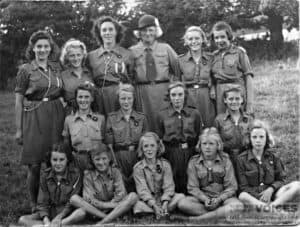 Pat Burt, Heather Doe,  with Mrs Hans Hamilton at Guide camp 1945 