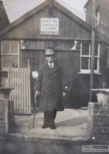 Robert May, carpenter and undertaker outside his workshop