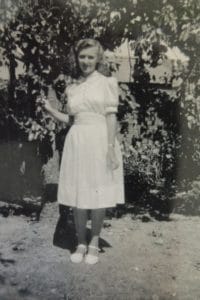 Delia Whitehead nee Hunt in her Confirmation Dress made from parachute silk.